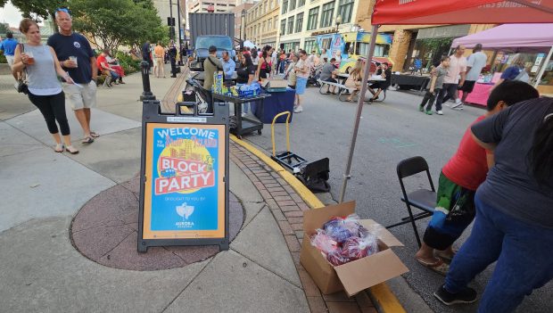 The Aurora Downtown group hosted the Stolp Island Block Party in downtown Aurora Friday evening as part of its monthly First Fridays event. (David Sharos / For The Beacon-News)