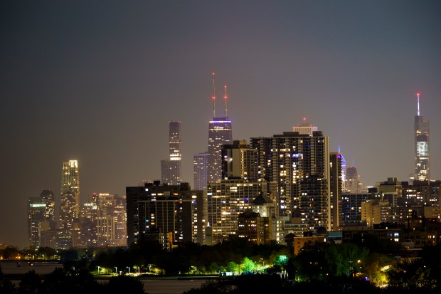 Lights illuminate the Chicago skyline as seen from Northwestern University in Evanston on May 15, 2022.