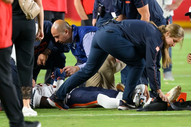 Bears' Douglas Coleman III is treated on the field after being injured during the second half on Aug. 22, 2024 in Kansas City, Mo. (AP Photo/Reed Hoffmann)