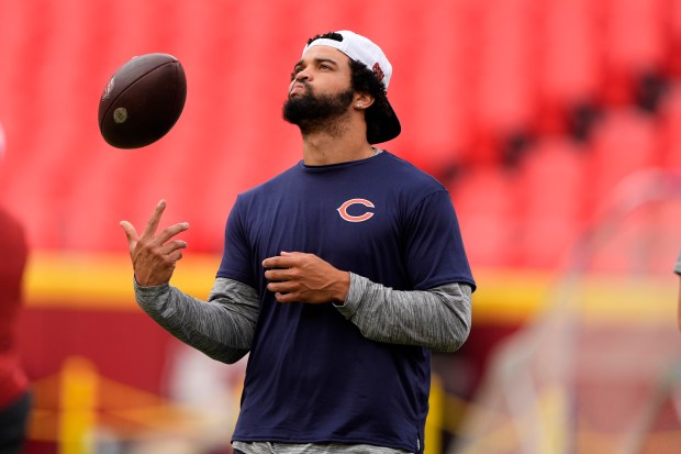 Caleb Williams warms up before the start of an NFL preseason football game against the Kansas City Chiefs Thursday, Aug. 22, 2024, in Kansas City, Mo. (AP Photo/Charlie Riedel)