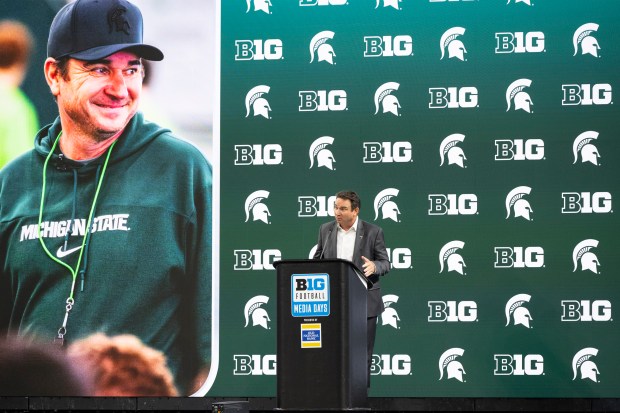 Michigan State coach Jonathan Smith talks with reporters at Big Ten media days at Lucas Oil Stadium on July 24, 2024, in Indianapolis. (Doug McSchooler/AP)