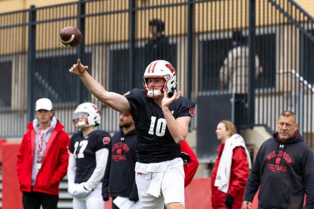 Wisconsin quarterback Tyler Van Dyke throws a pass during a spring practice in Madison, Wis., on April 20, 2024. (Samantha Madar/Wisconsin State Journal via AP)