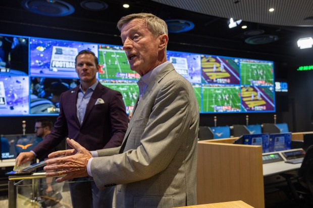 Big Ten coordinator of football officials Bill Carollo, right, and vice president of football administration A.J. Edds, left, offer a preview of the conference's new replay center ahead of the college football season on Tuesday, Aug. 27, 2024, in Rosemont. (Tess Crowley/Chicago Tribune)