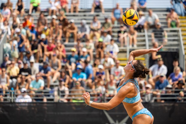 Piper Ferch serves in the AVP Chicago Open at Oak Street Beach in Chicago on Aug. 30, 2024. (Tess Crowley/Chicago Tribune)