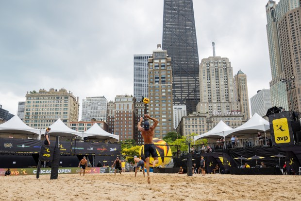 Trevor Crabb serves in the AVP Chicago Open at Oak Street Beach in Chicago on Aug. 30, 2024. (Tess Crowley/Chicago Tribune)