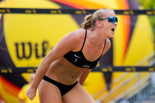 Sarah Hughes celebrates after scoring a point in the AVP Chicago Open at Oak Street Beach in Chicago on Aug. 30, 2024. (Tess Crowley/Chicago Tribune)