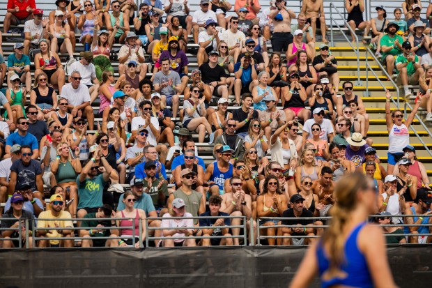 Fans cheer during a match in the AVP Chicago Open at Oak Street Beach in Chicago on Aug. 30, 2024. (Tess Crowley/Chicago Tribune)