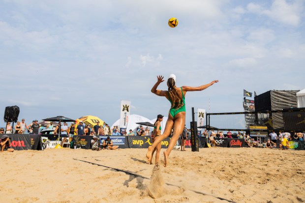 Brandie Wilkerson serves the ball in the AVP Chicago Open at Oak Street Beach in Chicago on Aug. 30, 2024. (Tess Crowley/Chicago Tribune)