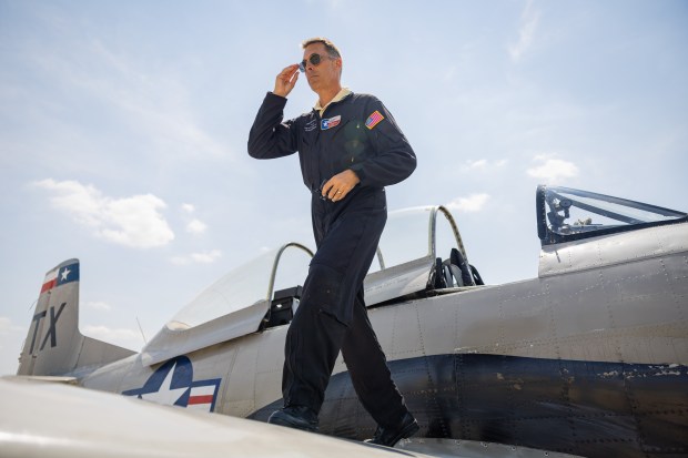 Trojan Phlyers Flight Demonstration Team pilot Robert Johnson prepares to fly in a North American T-28 Trojan aircraft in Gary, Indiana on Aug. 8, 2024, ahead of the Chicago Air and Water Show. (Tess Crowley/Chicago Tribune)