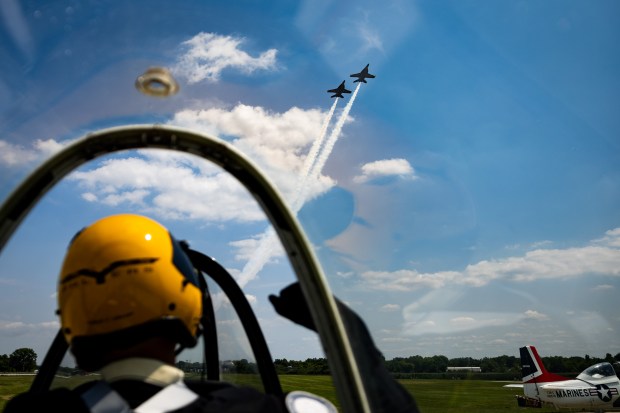 Trojan Phlyers Flight Demonstration Team pilot Robert Johnson cheers as the U.S. Navy Blue Angels rehearse above Gary, Indiana on Aug. 8, 2024. The Chicago Air and Water Show is this weekend. (Tess Crowley/Chicago Tribune)