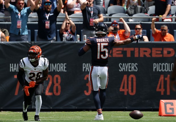 Bears wide receiver Rome Odunze (15) makes a first down gesture after a reception against Bengals cornerback Josh Newton (28) in the second quarter of a preseason game at Soldier Field on Aug. 17, 2024, in Chicago. (John J. Kim/Chicago Tribune)