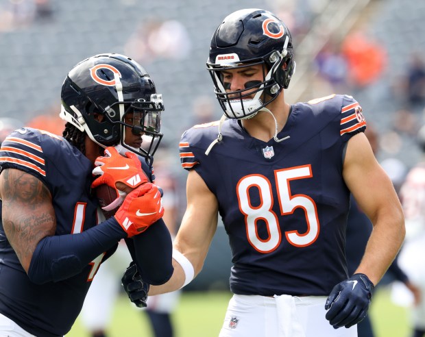 Bears tight ends Gerald Everett (14), left, and Cole Kmet (85) warm up for a preseason game against the Bengals at Soldier Field on Aug. 17, 2024, in Chicago. (John J. Kim/Chicago Tribune)