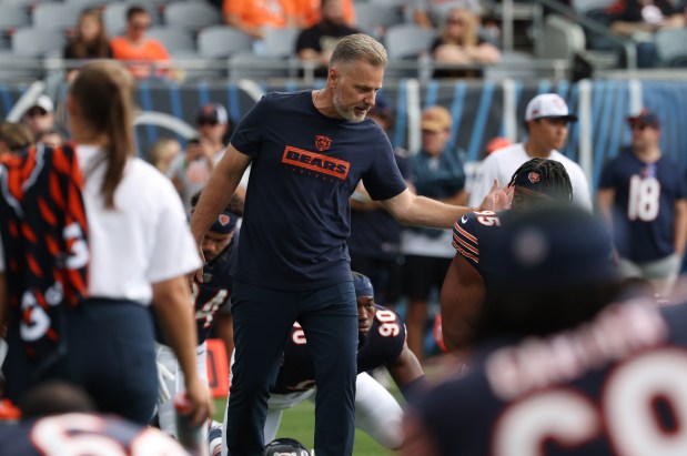 Bears head coach Matt Eberflus greets players before a preseason game against the Bengals at Soldier Field on Aug. 17, 2024, in Chicago. (John J. Kim/Chicago Tribune)