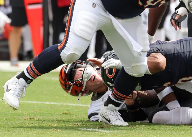 Bengals quarterback Logan Woodside (11) is sacked by Bears cornerback Kyler Gordon (6) in the first quarter of a preseason game at Soldier Field on Aug. 17, 2024, in Chicago. (John J. Kim/Chicago Tribune)