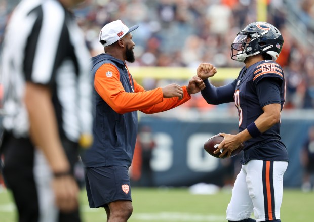 Bears quarterback Caleb Williams (18) celebrates with teammates after rushing for a touchdown in the second quarter against the Bengals in a preseason game at Soldier Field on Aug. 17, 2024, in Chicago. (John J. Kim/Chicago Tribune)