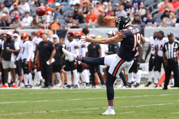 Tory Taylor punts in the first quarter against the Bengals in a preseason game at Soldier Field on Aug. 17, 2024. (John J. Kim/Chicago Tribune)