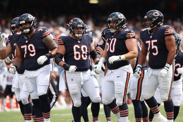 The Bears offensive line head to the line of scrimmage against the Bengals in the third quarter of a preseason game at Soldier Field on Aug. 17, 2024, in Chicago. (John J. Kim/Chicago Tribune)