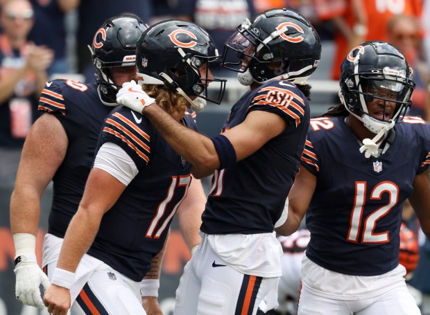 Bears quarterback Tyson Bagent (17) celebrates with wide receiver Dante Pettis (81) after a touchdown reception by Pettis in the third quarter against the Bengals in a preseason game at Soldier Field on Aug. 17, 2024, in Chicago. (John J. Kim/Chicago Tribune)