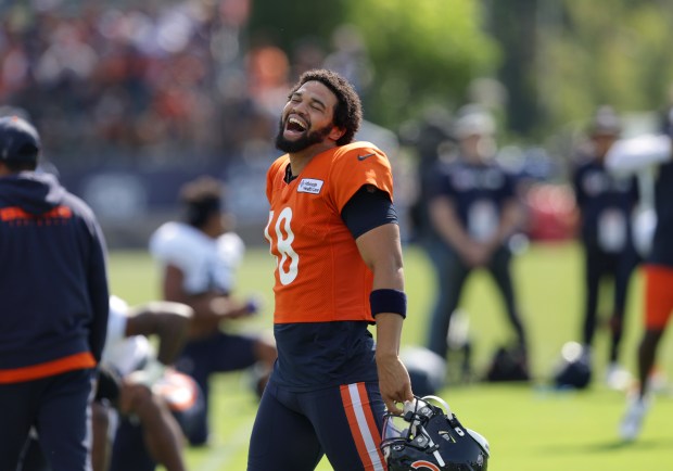 Bears quarterback Caleb Williams jokes with teammates during training camp at Halas Hall on Aug. 7, 2024, in Lake Forest. (Stacey Wescott/Chicago Tribune)