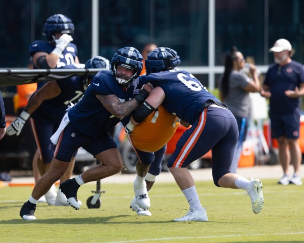 Bears guard Ryan Bates, left, faces off against offensive tackle Theo Benedet during training camp on July 26, 2024, in Lake Forest. (Stacey Wescott/Chicago Tribune)