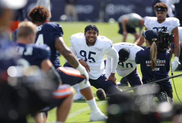 Chicago Bears defensive end DeMarcus Walker (95) is the center of attention by the HBO "Hard Knocks" camera crew during training camp at Halas Hall on Aug. 7, 2024, in Lake Forest. (Stacey Wescott/Chicago Tribune)