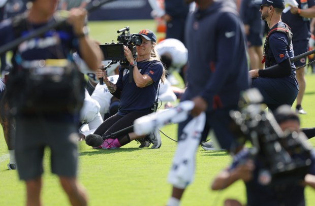 The "Hard Knocks" camera and sound crew film during Bears training camp at Halas Hall on Aug. 7, 2024, in Lake Forest. (Stacey Wescott/Chicago Tribune)