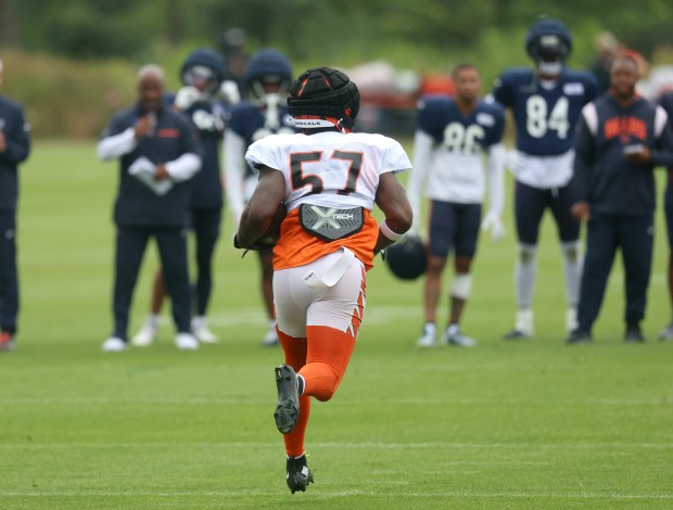 Cincinnati Bengals linebacker Germaine Pratt (57) intercepts the very first pass thrown by Chicago Bears quarterback Caleb Williams (18) during practice at Halas Hall with both the Chicago Bears and the Cincinnati Bengals on Aug. 15, 2024 in Lake Forest. (Stacey Wescott/Chicago Tribune)