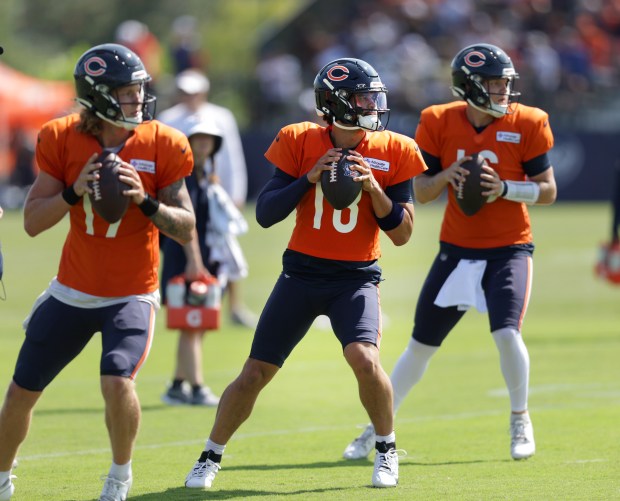 Bears quarterbacks Tyson Bagent, Caleb Williams and Austin Reed run through drills during training camp at Halas Hall on Aug. 7, 2024. (Stacey Wescott/Chicago Tribune)