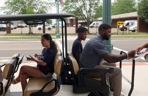 Pro Football Hall of Fame inductee Devin Hester signs autographs after a news conference at the Canton Repository on Aug. 2, 2024, in Canton, Ohio. (John J. Kim/Chicago Tribune)