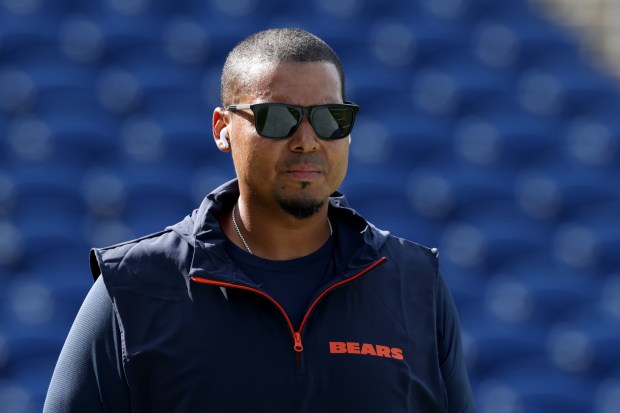 Bears general manager Ryan Poles walks the perimeter of the field before the Hall of Fame Game against the Texans at Tom Benson Hall of Fame Stadium on Aug. 1, 2024, in Canton. (John J. Kim/Chicago Tribune)