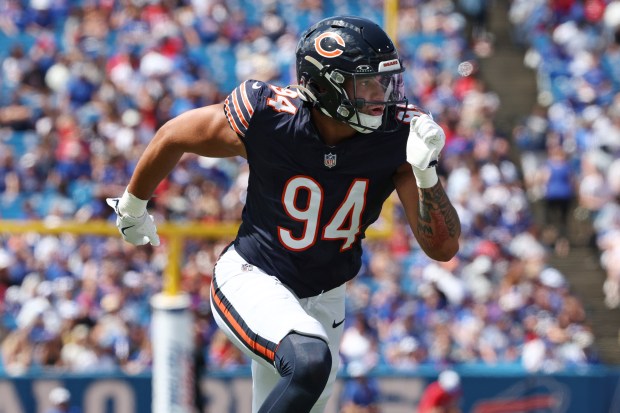 Bears defensive end Austin Booker rushes during the first half of a preseason game against the Bills in Orchard Park, N.Y., on Aug. 10, 2024. (AP Photo/Jeffrey T. Barnes)