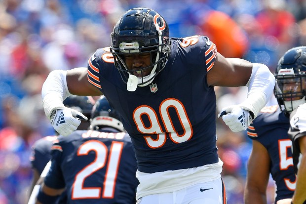 Bears defensive end Dominique Robinson celebrates a stop during the first half of a preseason game against the Bills on Saturday, Aug. 10, 2024, in Orchard Park, N.Y. (AP Photo/Adrian Kraus)