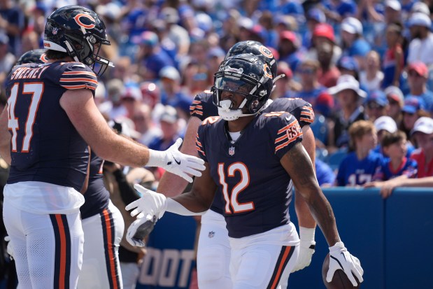 The Bears' Velus Jones Jr. celebrates a touchdown with Tommy Sweeney (47) during the second half of a preseason game against the Bills on Saturday, Aug. 10, 2024, in Orchard Park, NY. (AP Photo/Seth Wenig)