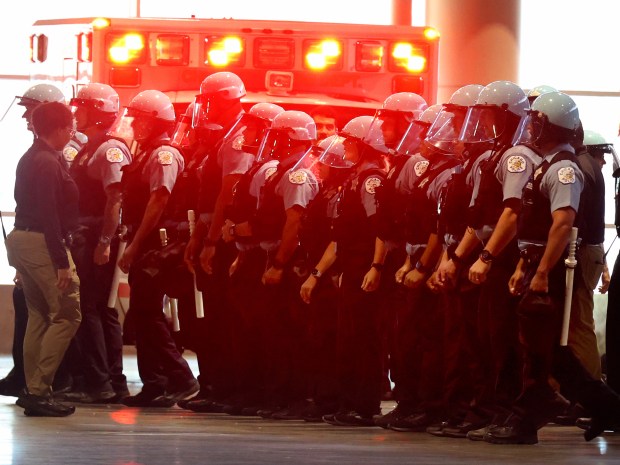 Police Officers march forward as they train to protect an injured person and an ambulance transport and keep back anyone who tries to cross the line as the Chicago Police Department offers a first look into how officers train at McCormick Place, Thursday, June 6, 2024, in preparation for the Democratic National Convention in Aug.. The officers at the training session were among 2,500 officers who will be on the front lines during the DNC. (Antonio Perez/Chicago Tribune)