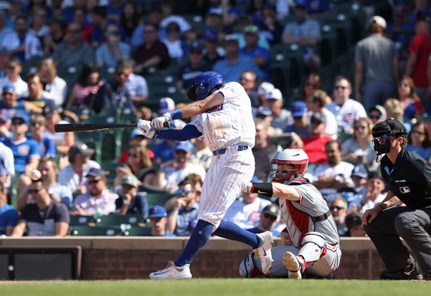 Cubs shortstop Dansby Swanson connects for an RBI single in the eighth inning against the Twins at Wrigley Field on Aug. 7, 2024, in Chicago. (John J. Kim/Chicago Tribune)