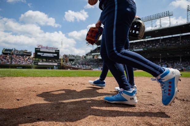 Cubs players run onfield before playing against the Toronto Blue Jays at Wrigley Field in Chicago on Aug. 16, 2024. The Cubs won 6-5 against the Toronto Blue Jays. (Tess Crowley/Chicago Tribune)