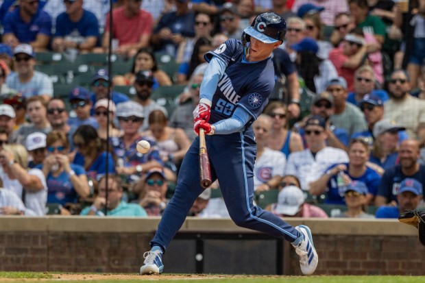 Chicago Cubs center fielder Pete Crow-Armstrong (52) hits a home run in the fifth inning against the Toronto Blue Jays at Wrigley Field in Chicago on Aug. 16, 2024. The Cubs won 6-5 against the Toronto Blue Jays. (Tess Crowley/Chicago Tribune)