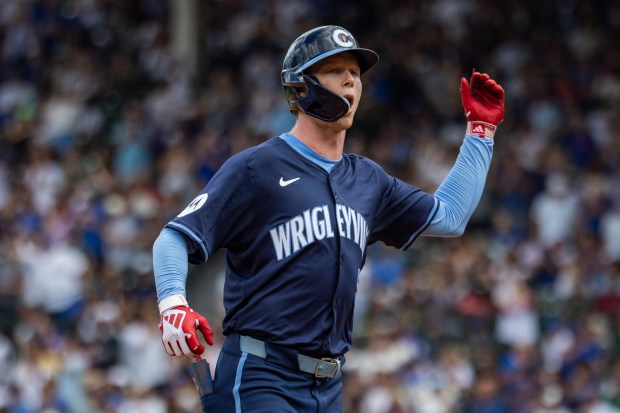 Chicago Cubs center fielder Pete Crow-Armstrong (52) hits a home run in the fifth inning against the Toronto Blue Jays at Wrigley Field in Chicago on Aug. 16, 2024. The Cubs won 6-5 against the Toronto Blue Jays. (Tess Crowley/Chicago Tribune)