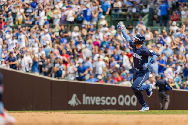 Chicago Cubs catcher Miguel Amaya (9) hits a home run in the 5th inning against the Toronto Blue Jays at Wrigley Field in Chicago on Aug. 16, 2024. The Cubs won 6-5 against the Toronto Blue Jays. (Tess Crowley/Chicago Tribune)