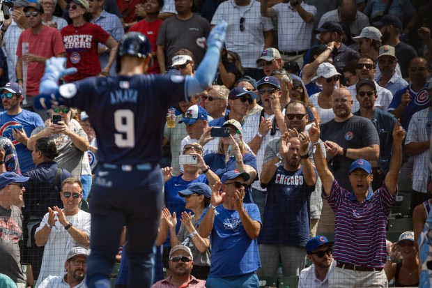 Fans cheer after Chicago Cubs catcher Miguel Amaya (9) hits a home run in the 5th inning against the Toronto Blue Jays at Wrigley Field in Chicago on Aug. 16, 2024. The Cubs won 6-5 against the Toronto Blue Jays. (Tess Crowley/Chicago Tribune)