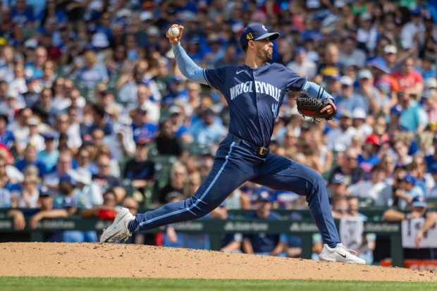 Chicago Cubs pitcher Jorge López (41) strikes out Toronto Blue Jays third base Ernie Clement (28) in the seventh inning against the Toronto Blue Jays at Wrigley Field in Chicago on Aug. 16, 2024. The Cubs won 6-5 against the Toronto Blue Jays. (Tess Crowley/Chicago Tribune)