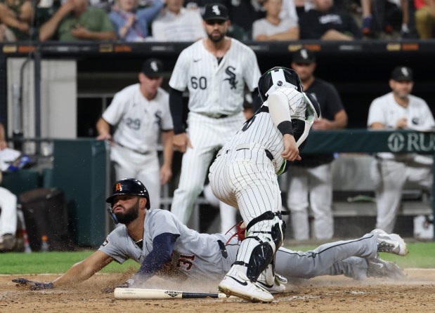 Tigers left fielder Riley Greene (31) beats the tag from White Sox catcher Korey Lee (26) to score off a single from second baseman Colt Keith in the seventh inning at Guaranteed Rate Field on Aug. 23, 2024, in Chicago. (John J. Kim/Chicago Tribune)