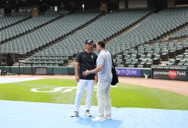 White Sox interim manager Grady Sizemore, left, talks with a reporter before a game against the Cubs at Guaranteed Rate Field on Aug. 9, 2024, in Chicago. (John J. Kim/Chicago Tribune)