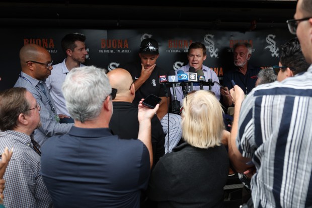 White Sox interim manager Grady Sizemore, center, and general manager Chris Getz, center right, answer reporters' questions before a game against the Cubs at Guaranteed Rate Field on Aug. 9, 2024, in Chicago. (John J. Kim/Chicago Tribune)