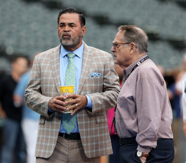 Ozzie Guillen, left, and White Sox owner Jerry Reinsdorf talk before a game between the White Sox and Cubs at Guaranteed Rate Field on Aug. 9, 2024, in Chicago. (John J. Kim/Chicago Tribune)