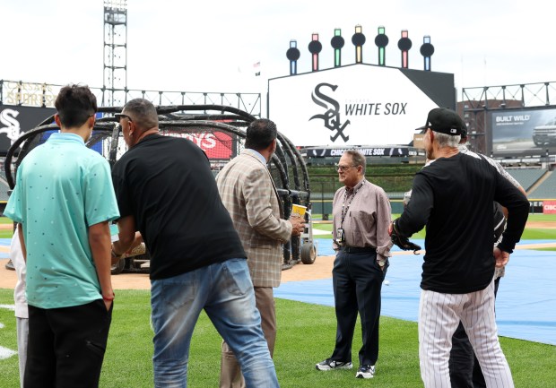 White Sox owner Jerry Reinsdorf, center right, spends time on the field before a game between the White Sox and Cubs at Guaranteed Rate Field on Aug. 9, 2024, in Chicago. (John J. Kim/Chicago Tribune)