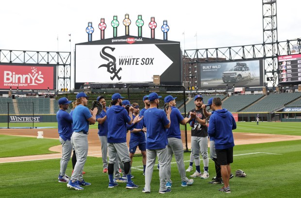 Cubs players have a meeting before a game against the White Sox at Guaranteed Rate Field on Aug. 9, 2024, in Chicago. (John J. Kim/Chicago Tribune)