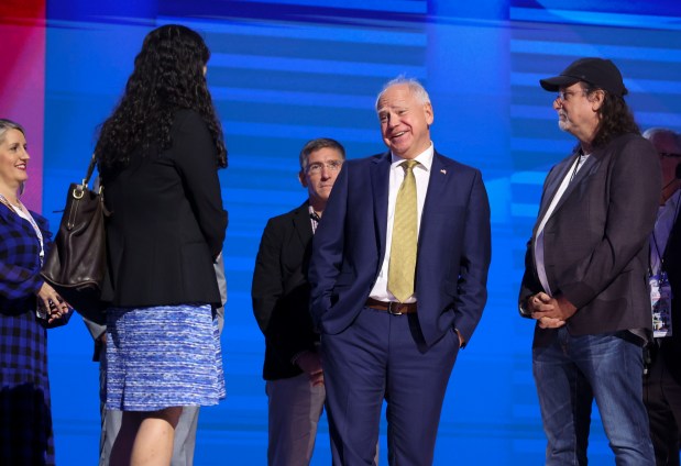 Democratic vice presidential nominee Minnesota Gov. Tim Walz checks out the stage in the afternoon before his speech Wednesday, Aug. 21, 2024, during the Democratic National Convention at the United Center. (Brian Cassella/Chicago Tribune)