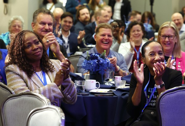 Democrats laugh during the speech of Georgia U.S. Sen. Raphael Warnock at Illinois' Presidential Delegation breakfast at the Royal Sonesta Hotel on Aug. 21. 2024, in Chicago. (Stacey Wescott/Chicago Tribune)