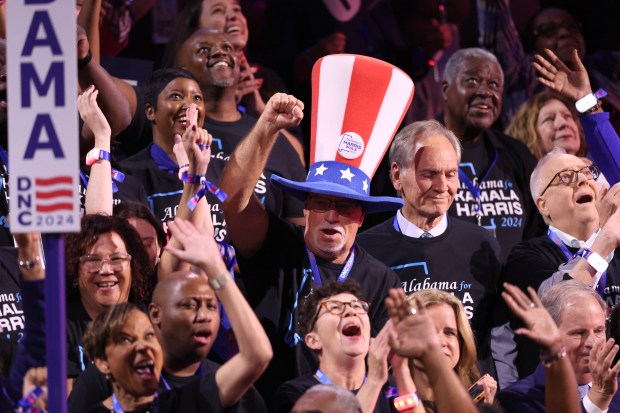 People in the crowd dance at the Democratic National Convention at the United Center in Chicago on Aug. 20, 2024. (Chris Sweda/Chicago Tribune)